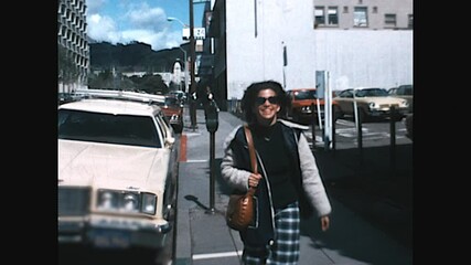 Woman Walking 1975 - A woman walks quickly on a sidewalk in San Francisco in 1975.