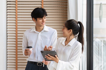 Business Professionals Engaging in Discussion and Idea Exchange in Modern Office Setting