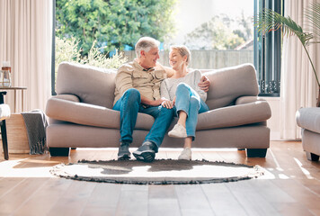 Mature, couple and relax with love on sofa with connection or support, embrace and affection with care for bonding. Senior, man and woman on couch for lounge on retirement, happy and family home.