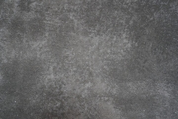 Grey concrete wall background, abstract backdrop with cement, sand details and texture, raw concrete surface.
