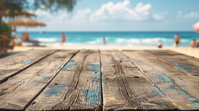 Weathered wooden planks with a blurred beach scene in the background