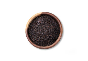 Black tea dried leaves on a bowl isolated over white background