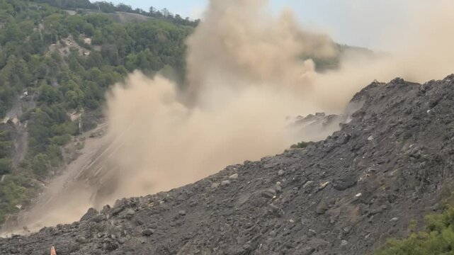 This Massive landslide cascading down a mountain, showcasing nature's raw power and destructive force.