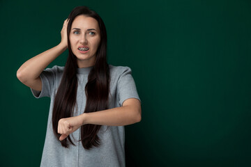 Worried Woman Holding Head in Hands