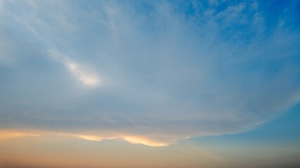 Serene sky at sunset with wispy clouds, symbolizing tranquility and peace, perfect for mental wellness themes and relaxation