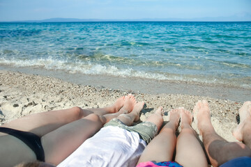 beautiful legs on the sand by the sea