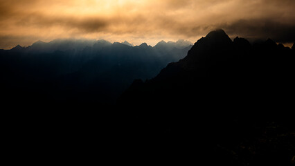 Dramatic sunrise over the Tatra Mountains from the Rysy Peak.
