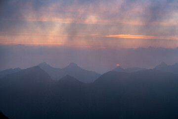 Dramatic sunrise over the Tatra Mountains from the Rysy Peak.