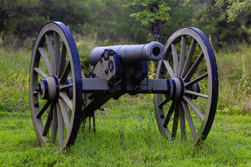 Civil war canon in the woods on the battlefield 