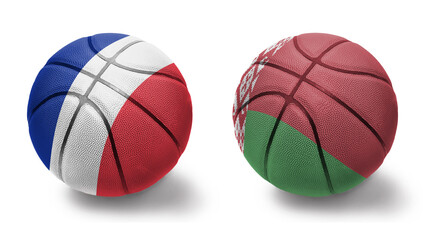 basketball balls with the national flags of belarus and france on the white background.