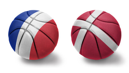 basketball balls with the national flags of denmark and france on the white background.