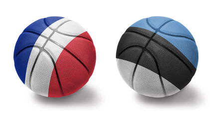 basketball balls with the national flags of estonia and france on the white background.