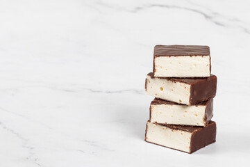 Bird's milk. Delicate dessert. Vanilla souffle in chocolate glaze. Copy space