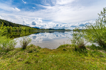 Leisurely hike in early summer at Rottachsee in the Allgau