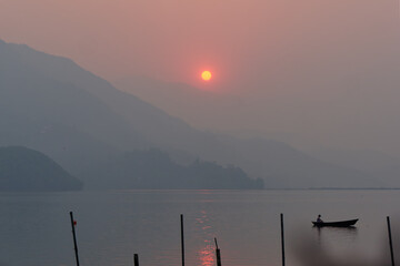 Serene view of the sunset over Lake Phewa, Pokhara, Nepal