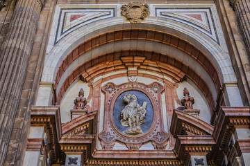 Obraz premium Architectural details of entrance to Malaga Cathedra. Cathedral is Roman Catholic Church (Santa Iglesia Catedral Basilica de la Encarnacion), was constructed in 1528 -1782. Malaga, Andalusia, Spain.