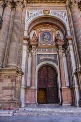 Fototapeta premium Architectural details of entrance to Malaga Cathedra. Cathedral is Roman Catholic Church (Santa Iglesia Catedral Basilica de la Encarnacion), was constructed in 1528 -1782. Malaga, Andalusia, Spain.