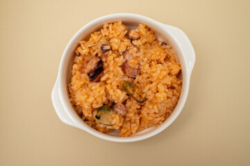 traditional portuguese dish rice with seafood in white dish