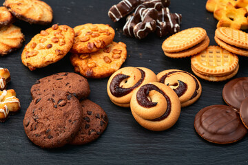 Mix of cookies . Many unhealthy snacks . Top view
