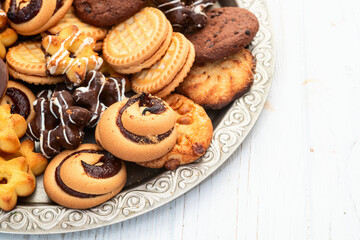 Mix of cookies . Many unhealthy snacks . Top view