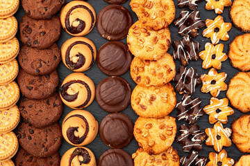 Mix of cookies . Many unhealthy snacks . Top view