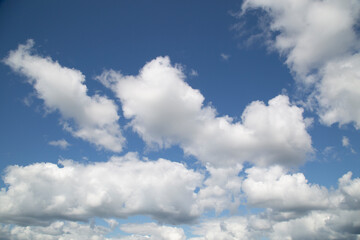 Background of summer clouds in a blue sky.Beautiful summer landscape with clouds.