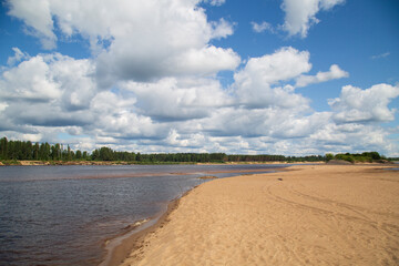 Beautiful summer landscape with clouds on the river.