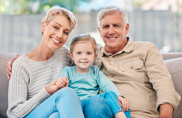 Grandparents, portrait and girl in house on sofa for relax, bonding and support with smile in lounge. Grandmother, face and grandpa in living room of home on couch for wellness, connection or hug