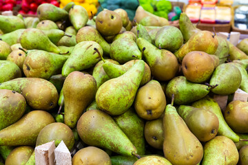 Fresh green pears in wooden box, big harvest