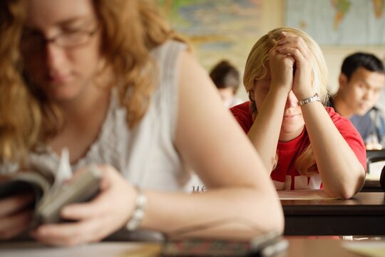 Students At A Bible Study And Prayer Class
