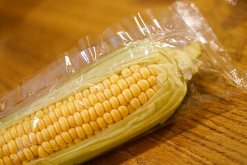 Fresh corn in a plastic bag. Close up 