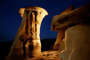 Unusual Rock Formations Against A Night Sky