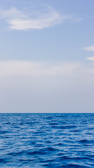 Blue ocean panorama with blue atmosphere, the vast open sea with clear sky, ripple wave and calm sea