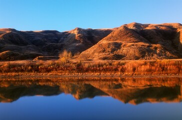 Red Rocky Earth Reflected Red Deer River, Drum Heller, Alberta, Canada