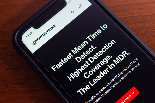 Vancouver, CANADA - Jul 22 2024 : CrowdStrike website seen in an iPhone. CrowdStrike is an US cybersecurity company that provides comprehensive security solutions to businesses and organizations.