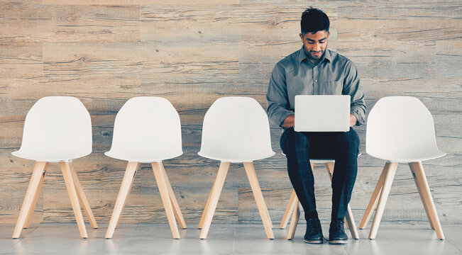 Businessman, chairs and laptop at interview in office for recruitment, job opportunity and waiting room. Hiring, candidate and tech with online research for onboarding appointment with mockup banner
