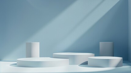 Sculpture exhibit with geometric shapes on display against a blue wall.