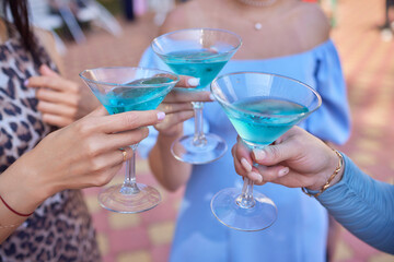At a lively nightclub, people are enjoying wine and socializing in a chic ambiance