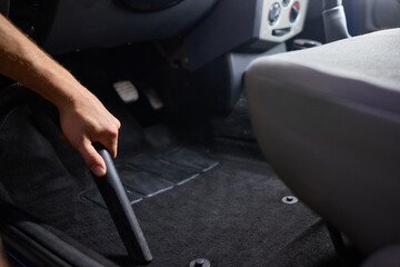 Car interior cleaning includes thorough cleaning under pedals for a tidy interior © Евгений Вершинин