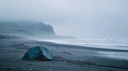 A lone tent pitched on a deserted beach, waves crashing against the shore in the distance, capturing the feeling of solitude and connection with nature.