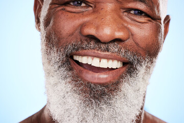 Obraz premium Face, skincare and senior black man in studio with smile, spa treatment and wellness. Dermatology, beard care and happy elderly person on blue background for aesthetic, grooming and healthy body
