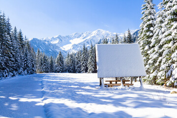 Cold sunny winter morning in Tatra mountains with the picnic table