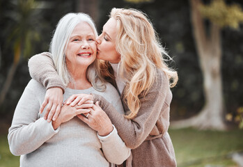 Kiss, woman and senior mom in garden with smile, gratitude and embrace in outdoor bonding together....