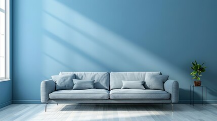 Trendy gray couch by blue wall in room. Decor