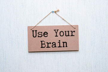 The phrase Use Your Brain in blue text on an index card.