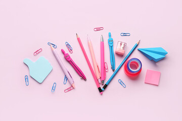 Composition with stationery supplies on pink background