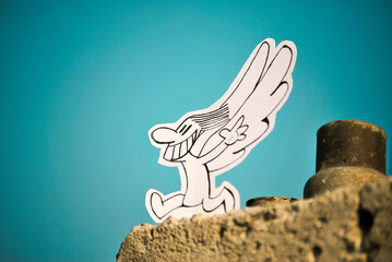 cartoon character with wings on blue sky