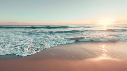 Obraz premium The ocean is calm and the sun is setting, creating a beautiful and serene atmosphere. The water is a deep blue color, and the sand is a warm brown color. The waves are gentle