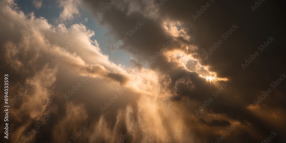 Poster Golden rays of sunlight illuminate fluffy clouds in a dramatic sunset sky