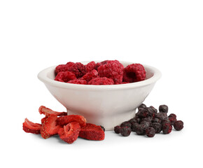 Bowl with freeze-dried raspberry, strawberry and black currant on white background